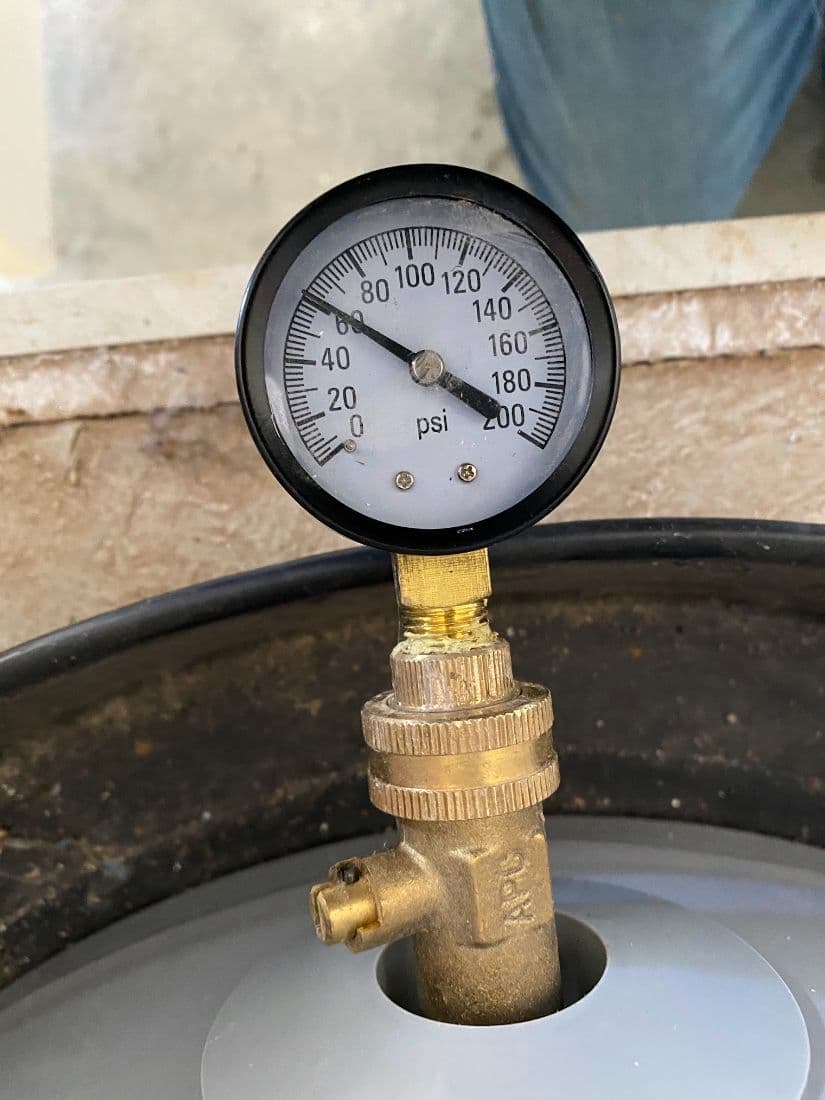 Pressure gauge testing a water heater expansion tank