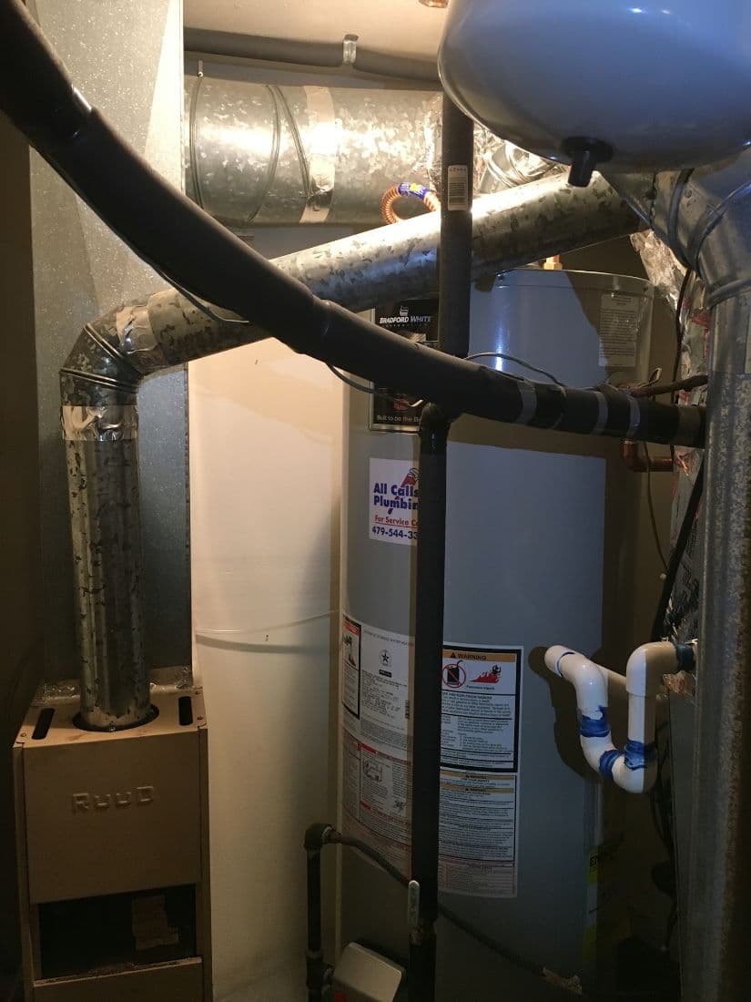 Bradford White water heater installed with an All Calls Plumbing service sticker