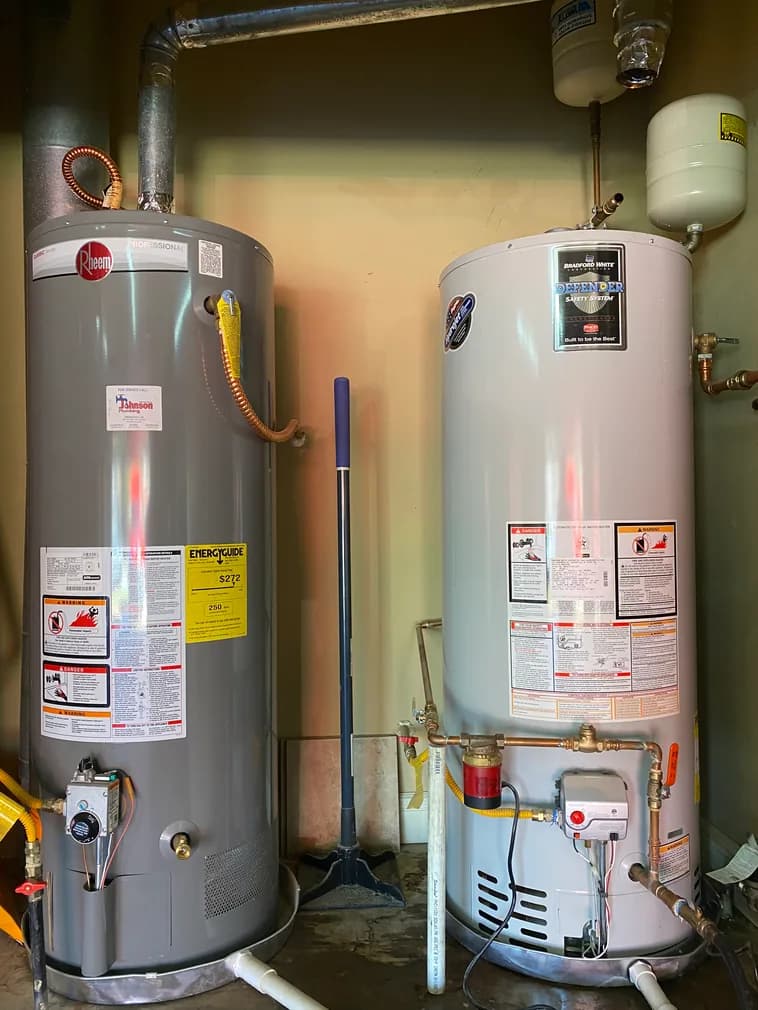 Rheem and Bradford White water heaters installed side by side with expansion tank