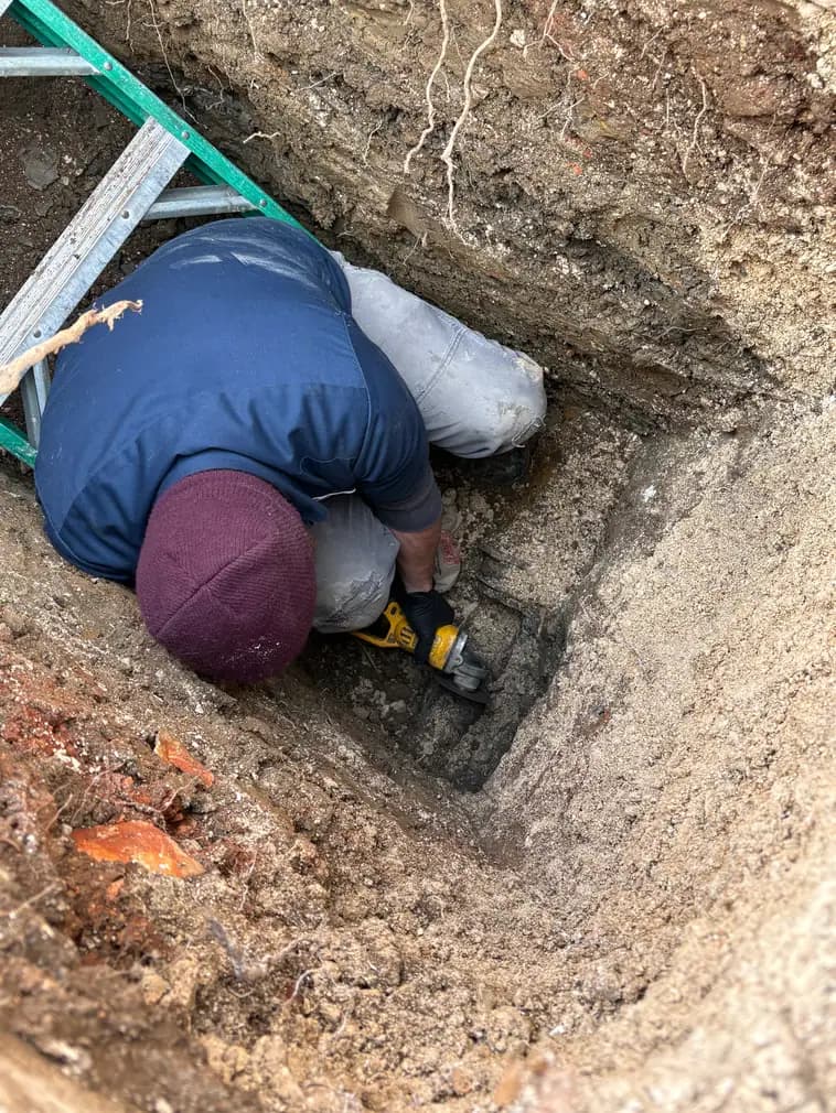 Sewer line repair in trench
